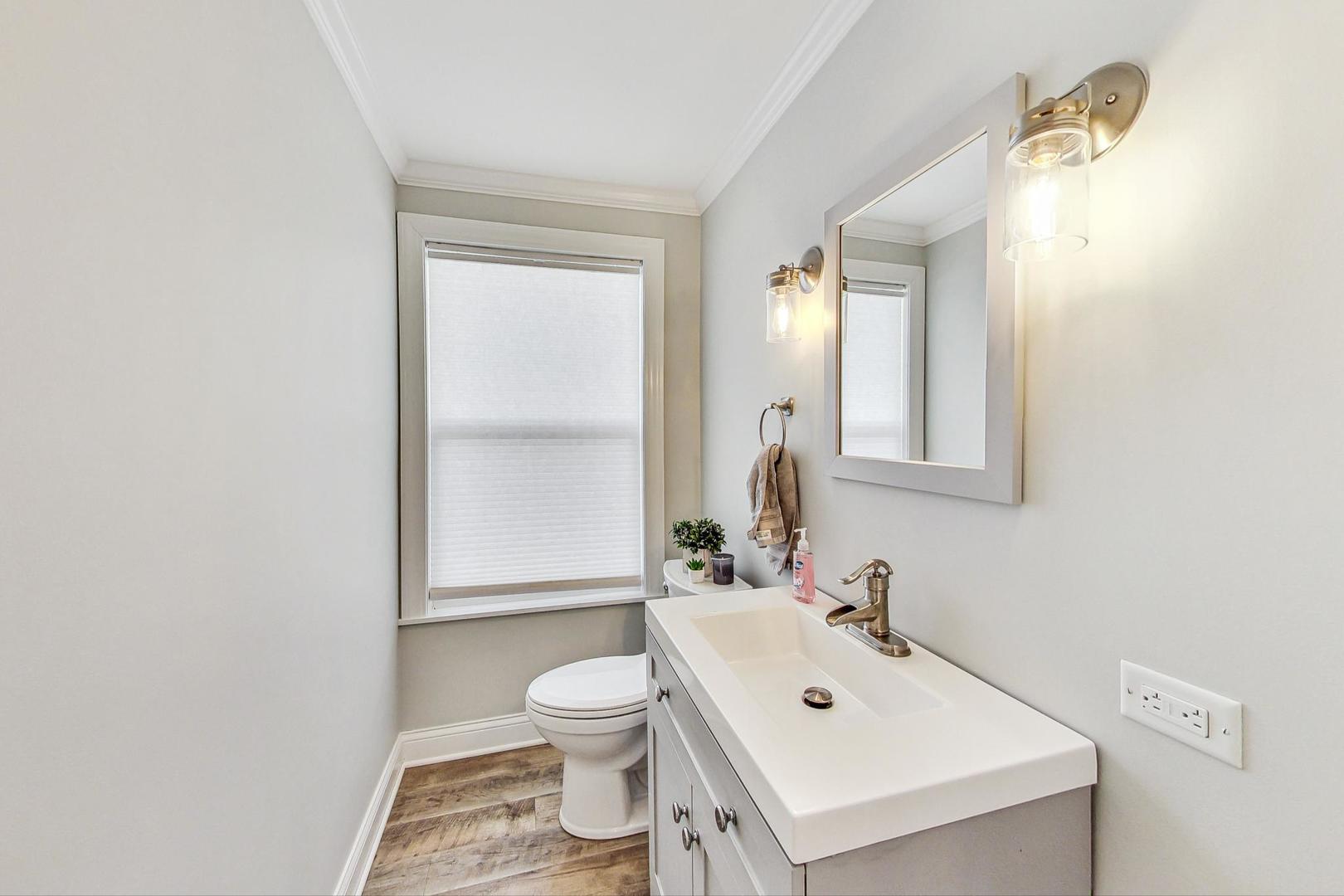 837 Foster Avenue Bartlett, IL 60103 - Photo 12 of 46 a bathroom with a sink mirror and toilet