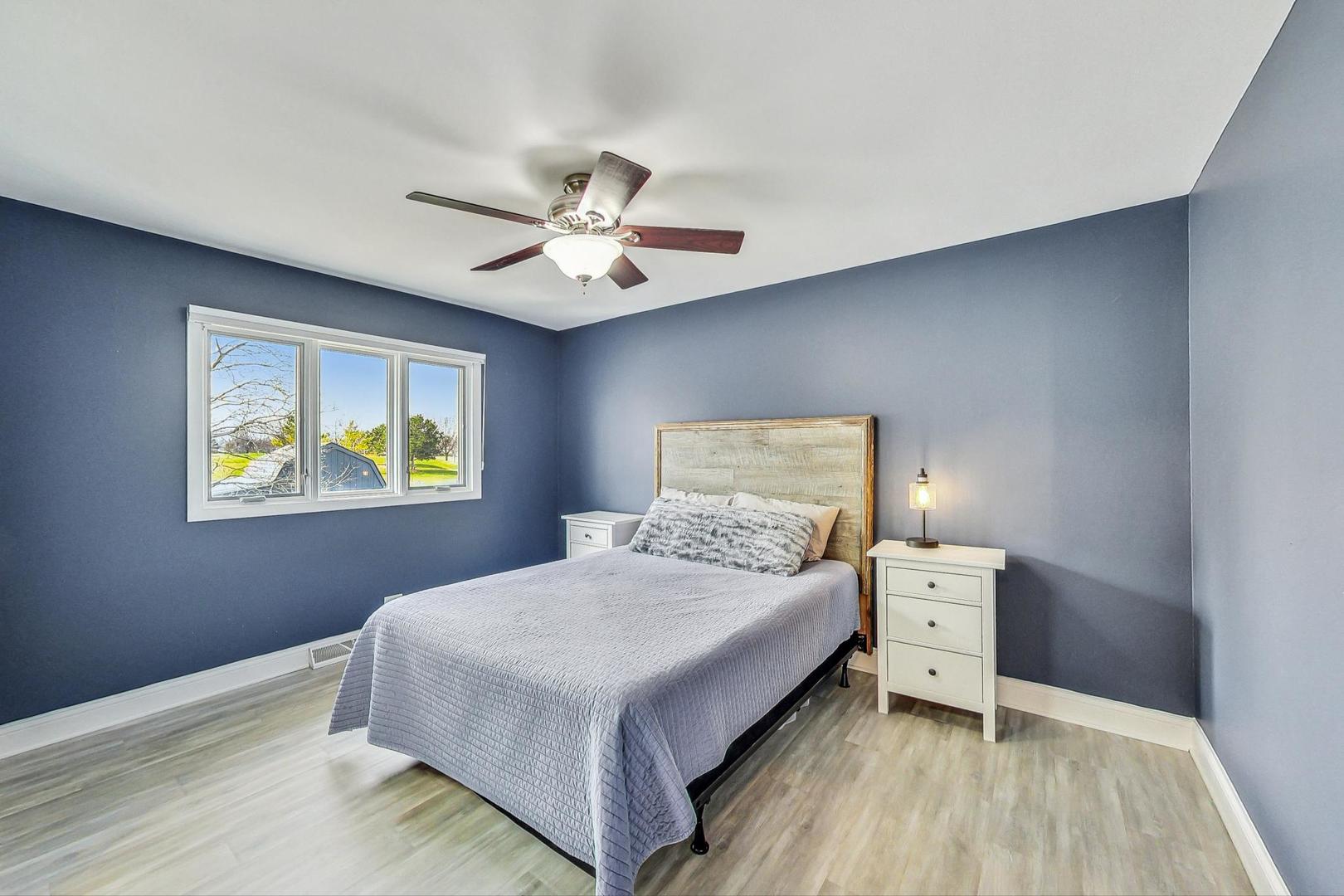 837 Foster Avenue Bartlett, IL 60103 - Photo 14 of 46 a bedroom with a bed and a window