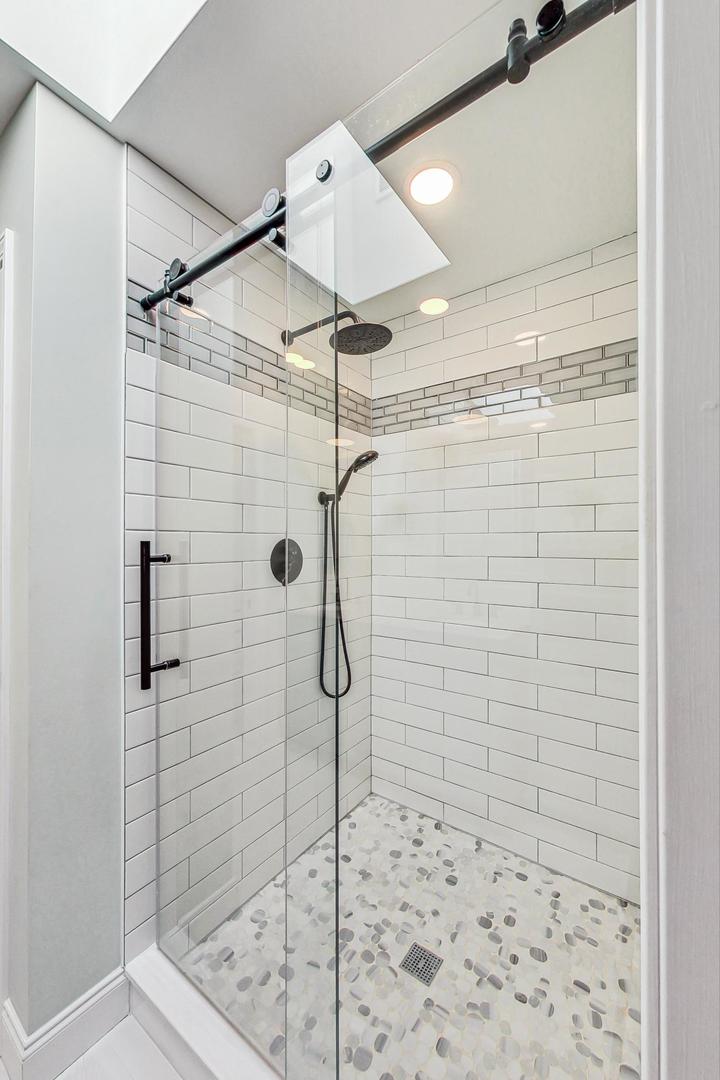 837 Foster Avenue Bartlett, IL 60103 - Photo 18 of 46 a bathroom with a shower