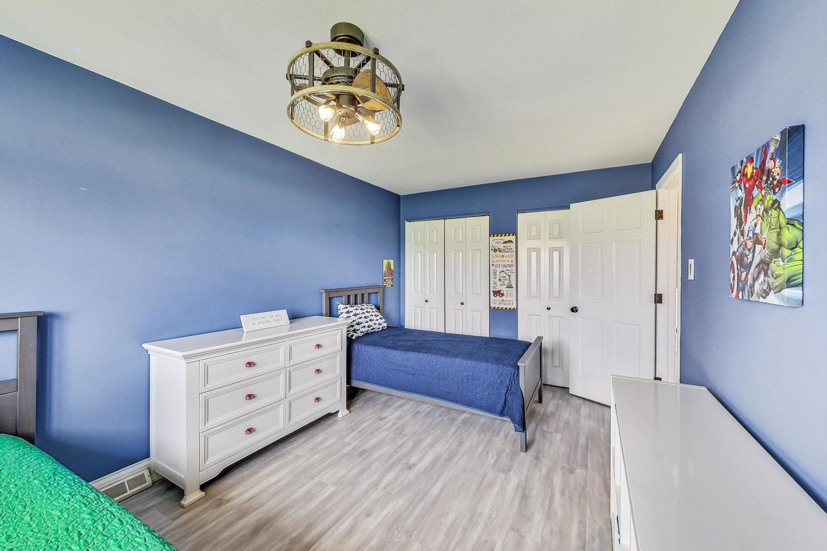 837 Foster Avenue Bartlett, IL 60103 - Photo 22 of 46 a bedroom with a bed and painting on the wall