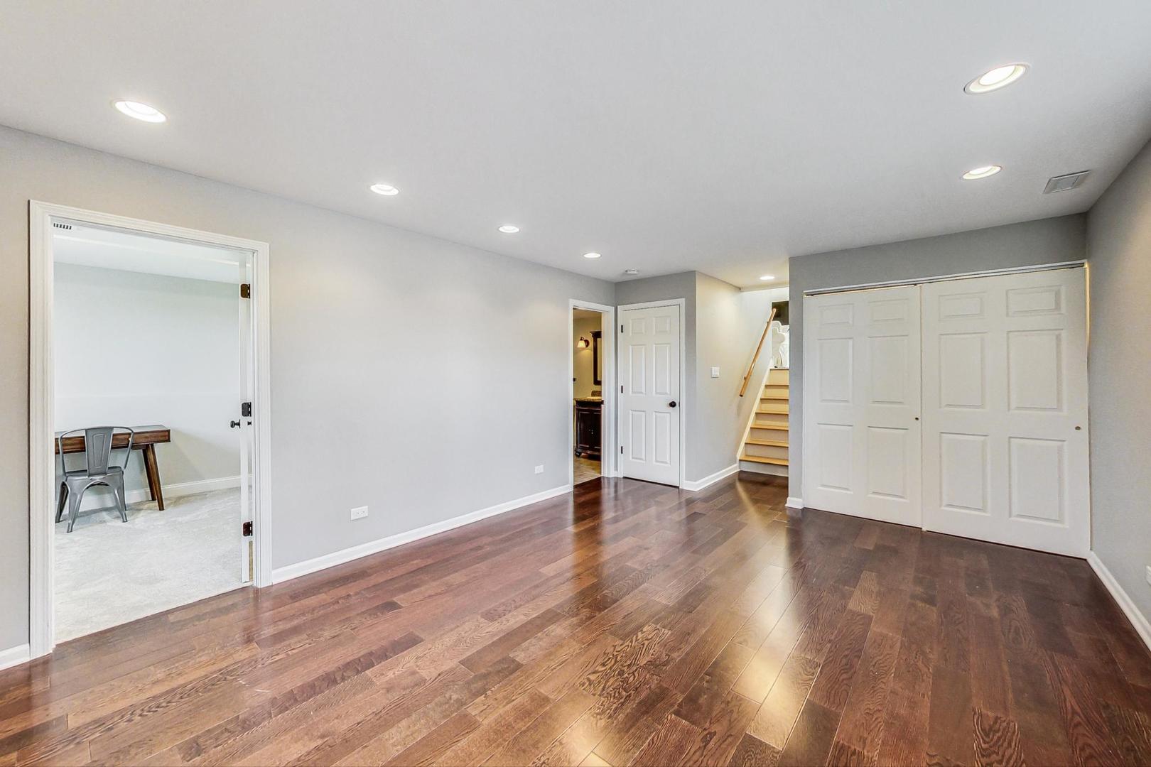 837 Foster Avenue Bartlett, IL 60103 - Photo 25 of 46 an empty room with wooden floor and closet