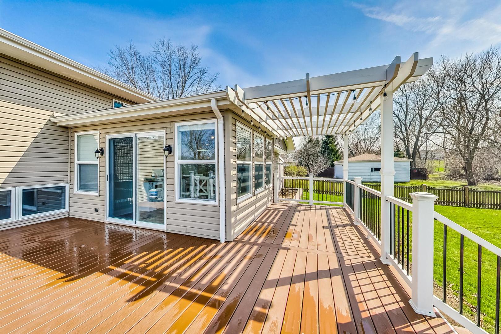 837 Foster Avenue Bartlett, IL 60103 - Photo 35 of 46 a view of balcony with a large window and wooden floor