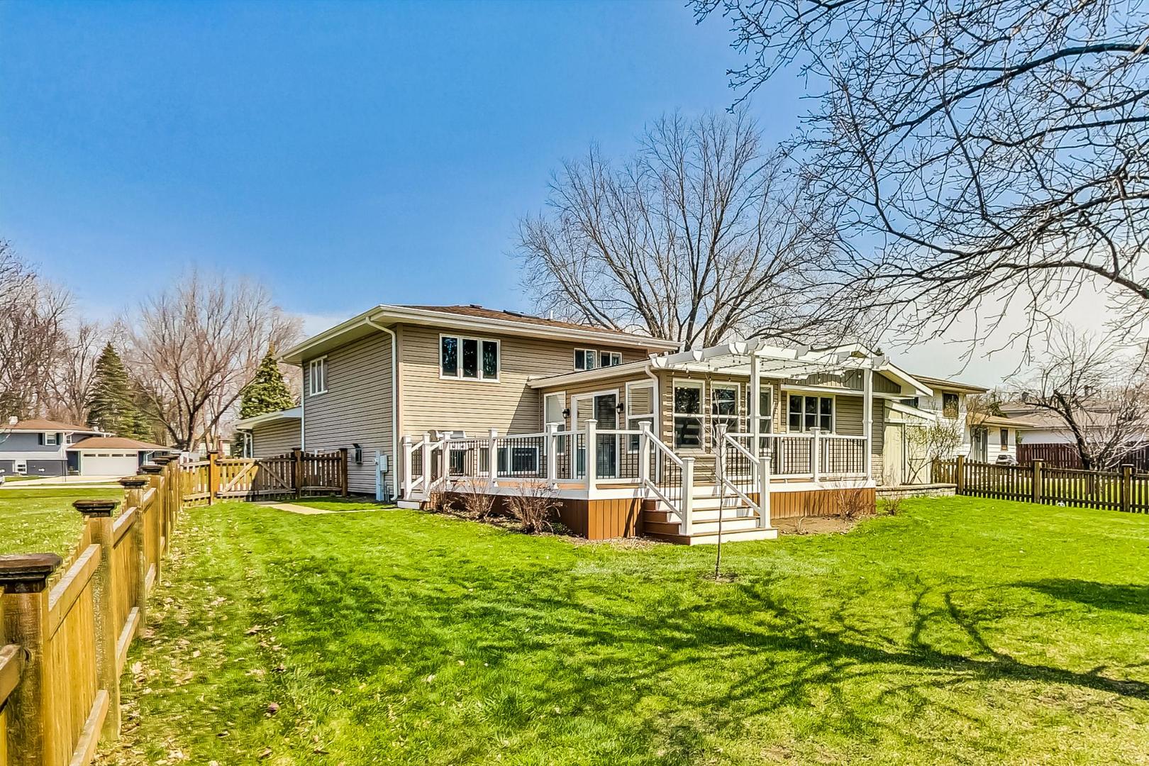 837 Foster Avenue Bartlett, IL 60103 - Photo 38 of 46 a front view of a house with a yard table and chairs