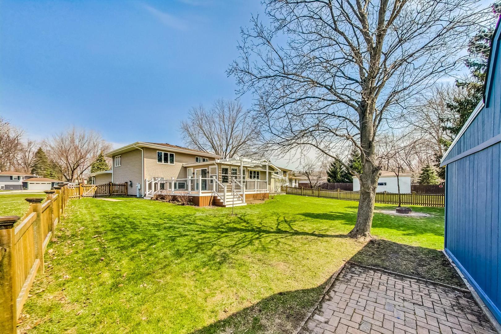 837 Foster Avenue Bartlett, IL 60103 - Photo 40 of 46 a front view of house with yard and green space