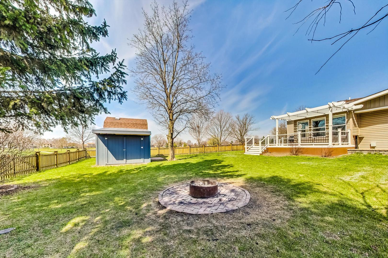837 Foster Avenue Bartlett, IL 60103 - Photo 41 of 46 a large house with a big yard and potted plants
