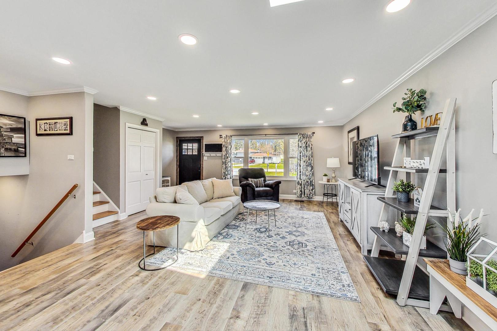 837 Foster Avenue Bartlett, IL 60103 - Photo 6 of 46 a living room with furniture and a wooden floor