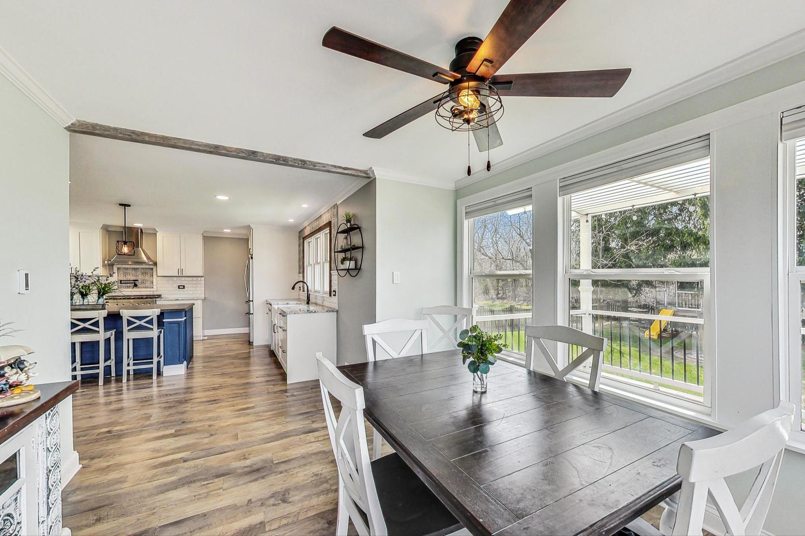 837 Foster Avenue Bartlett, IL 60103 - Photo 10 of 46 a view of a dining room with furniture window and wooden floor