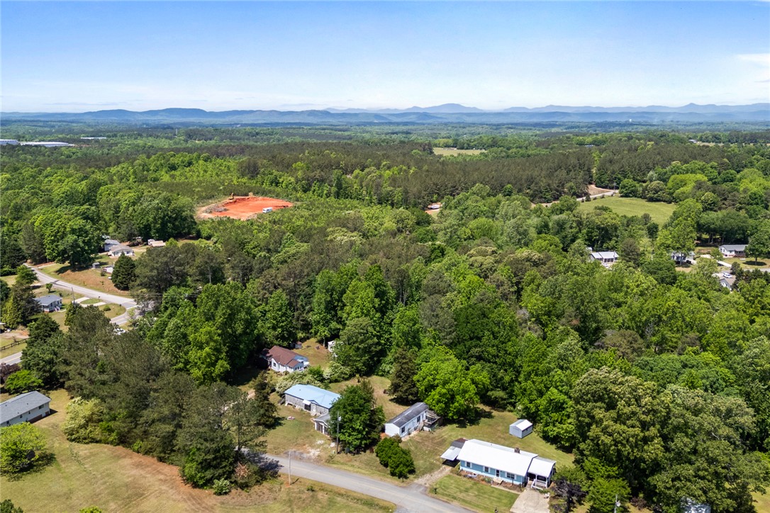209 Short Cut Road Westminster, SC 29693 - Photo 23 of 27 This elevated view captures the tranquil rural landscape with distant mountains.