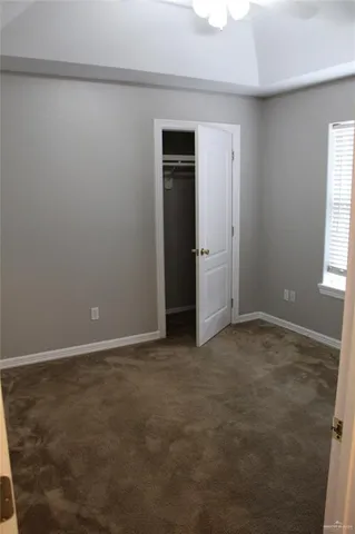an empty room with entrance and door