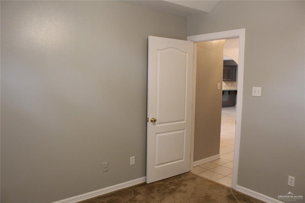 3824 Umar Avenue McAllen, TX 78504 - Photo 13 of 15 an empty room with entrance and door