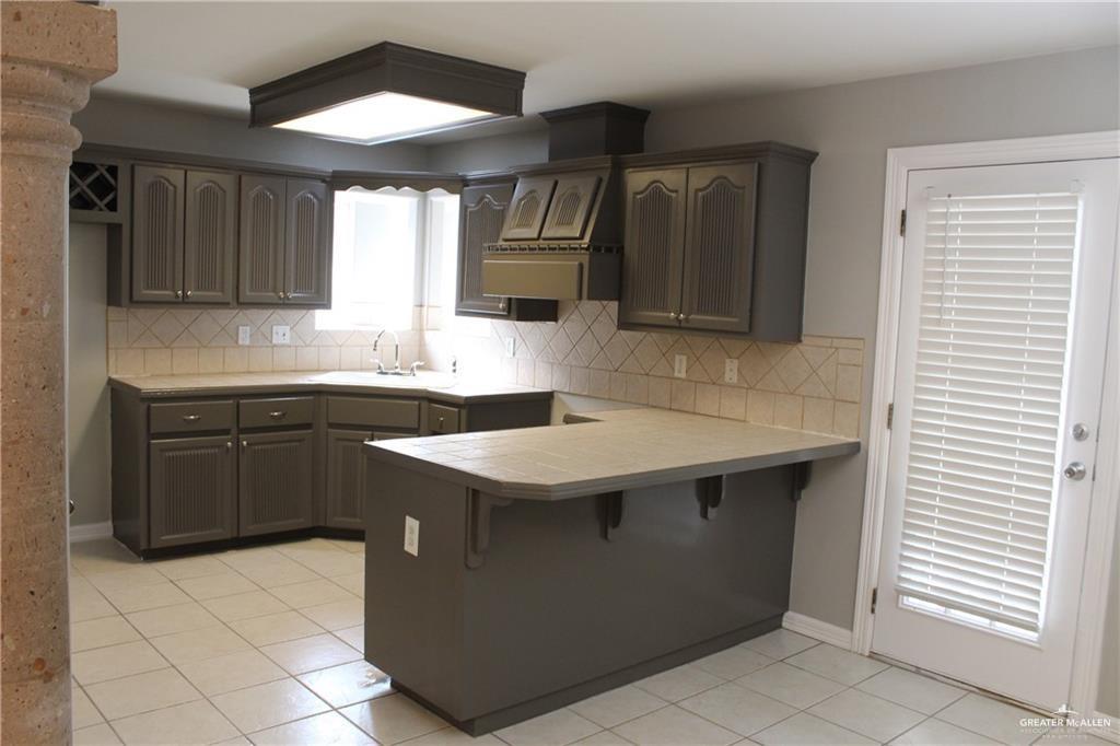 3824 Umar Avenue McAllen, TX 78504 - Photo 4 of 15 a kitchen with a sink cabinets and wooden floor