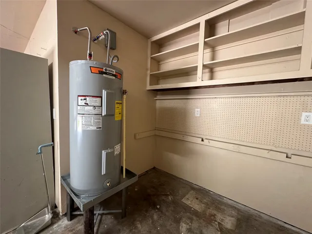 a room with a refrigerator and washer