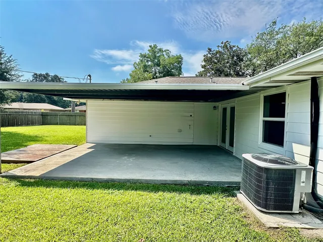 a backyard of a house with lots of green space