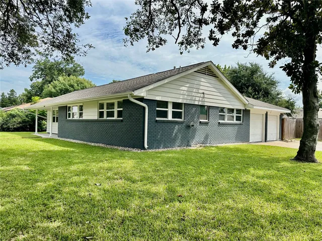a house view with a garden space