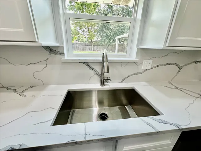 a kitchen with a sink and a window