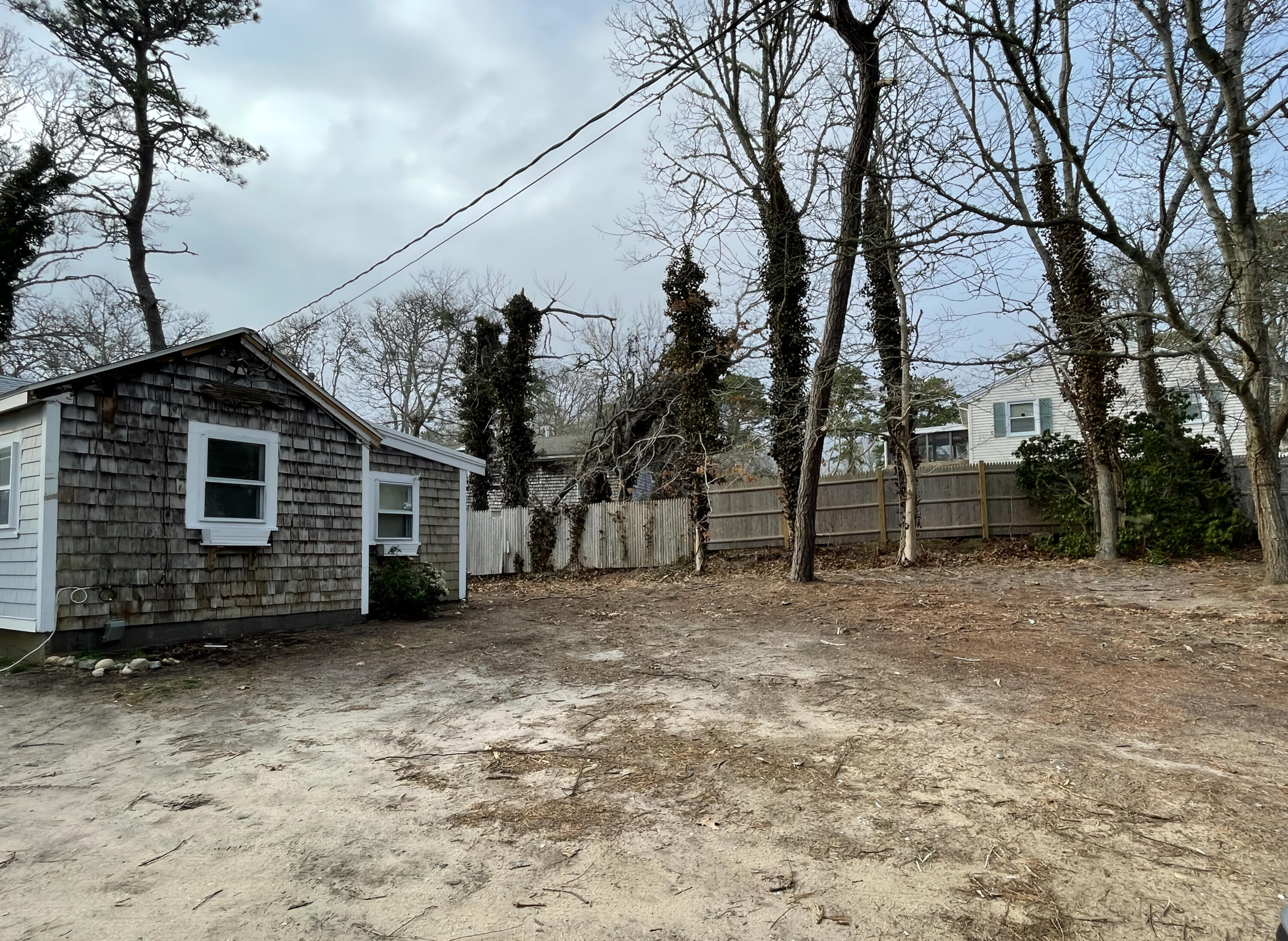 175 Telegraph Road Dennis Port, MA 02639 - Photo 6 of 12 a view of a backyard of the house