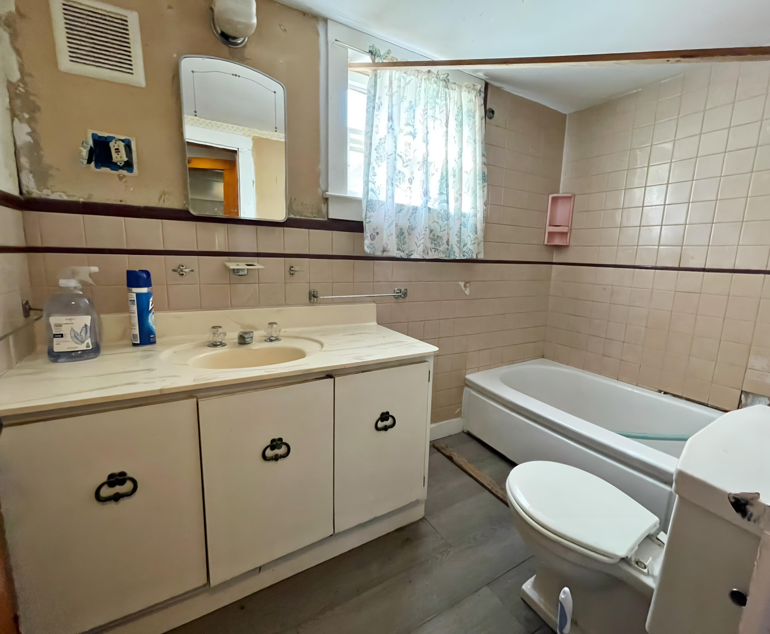 175 Telegraph Road Dennis Port, MA 02639 - Photo 7 of 12 a bathroom with a sink mirror vanity and toilet