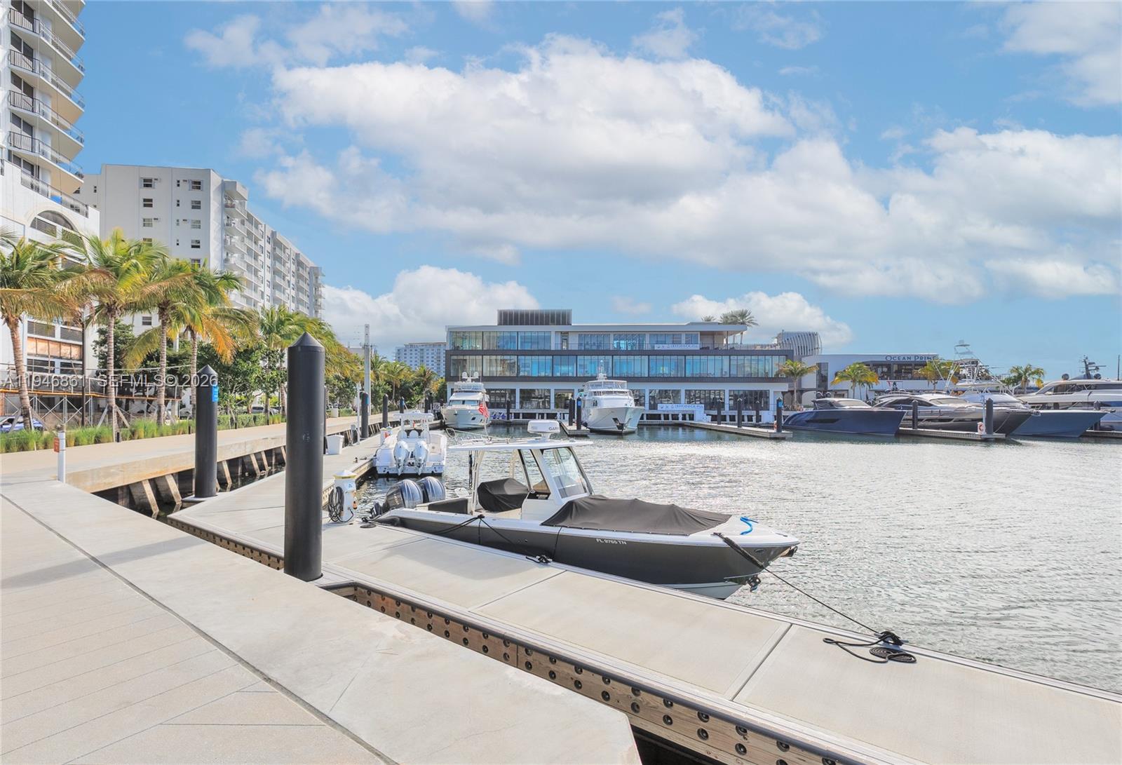 200 South Birch Road, Unit 1015 Fort Lauderdale, FL 33316 - Photo 32 of 36 a view of a swimming pool with lawn chairs