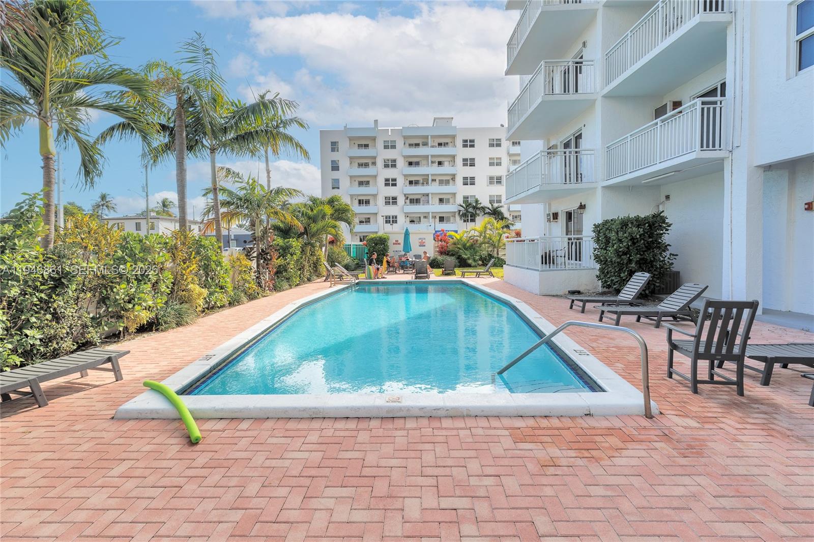 200 South Birch Road, Unit 1015 Fort Lauderdale, FL 33316 - Photo 35 of 36 a view of swimming pool outdoor seating and plants
