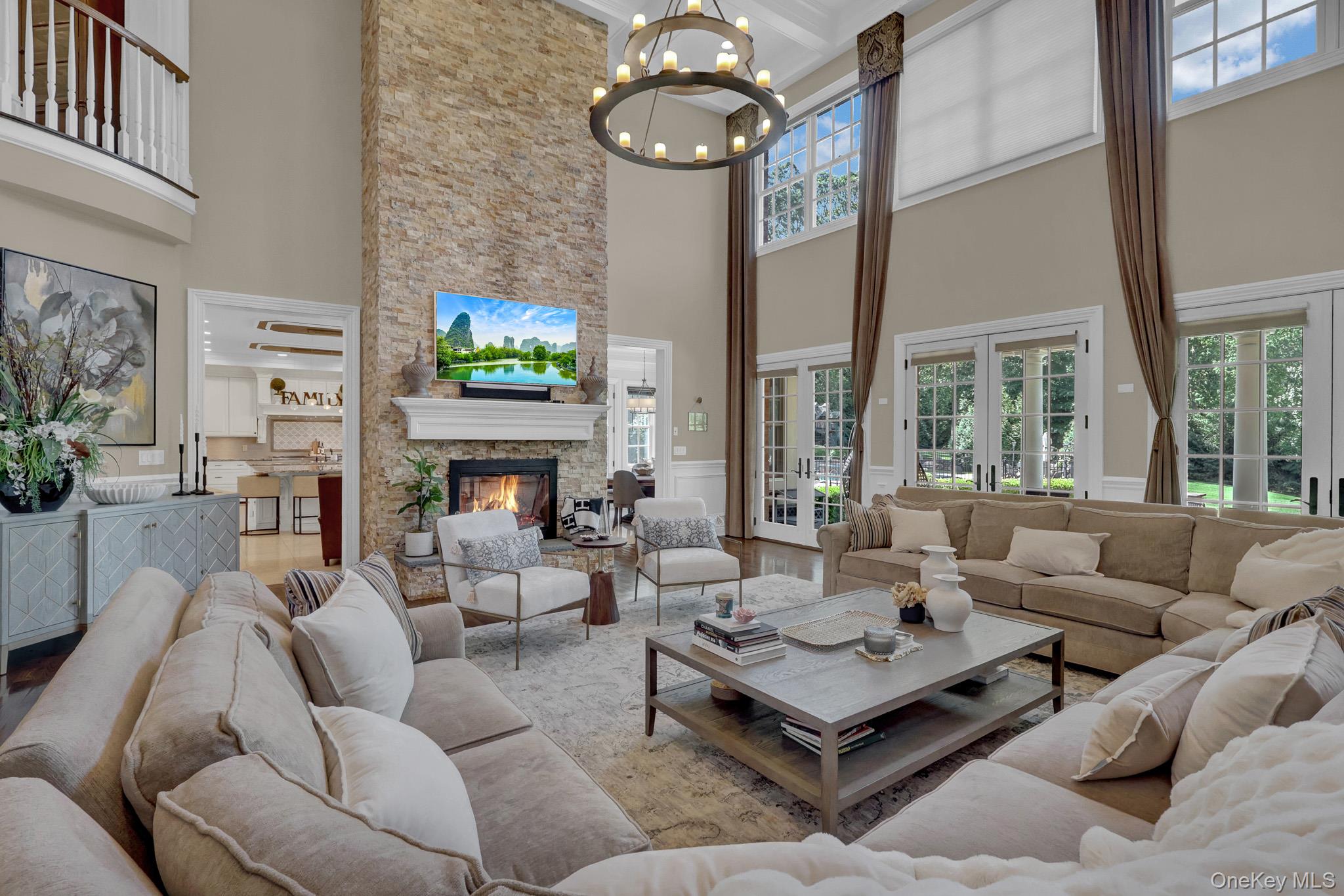 36 Old Field Road Setauket, NY 11733 - Photo 14 of 42 a living room with furniture a fireplace and a flat screen tv