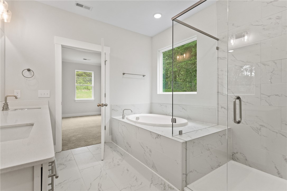 315 Old Shirley Road Central, SC 29630 - Photo 19 of 26 This serene bath features a deep soaking tub and a spacious shower.