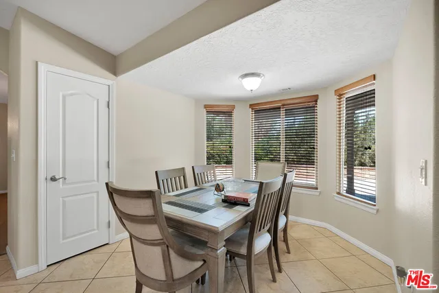 a kitchen with a sink and white cabinets
