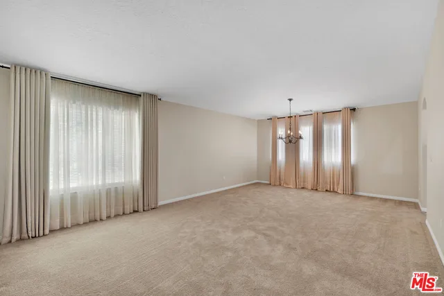 a kitchen with stainless steel appliances a sink stove and cabinets
