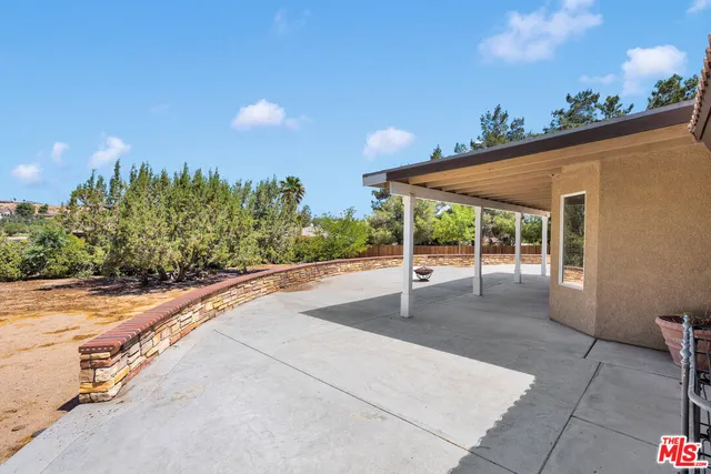 a view of a garage with parked cars