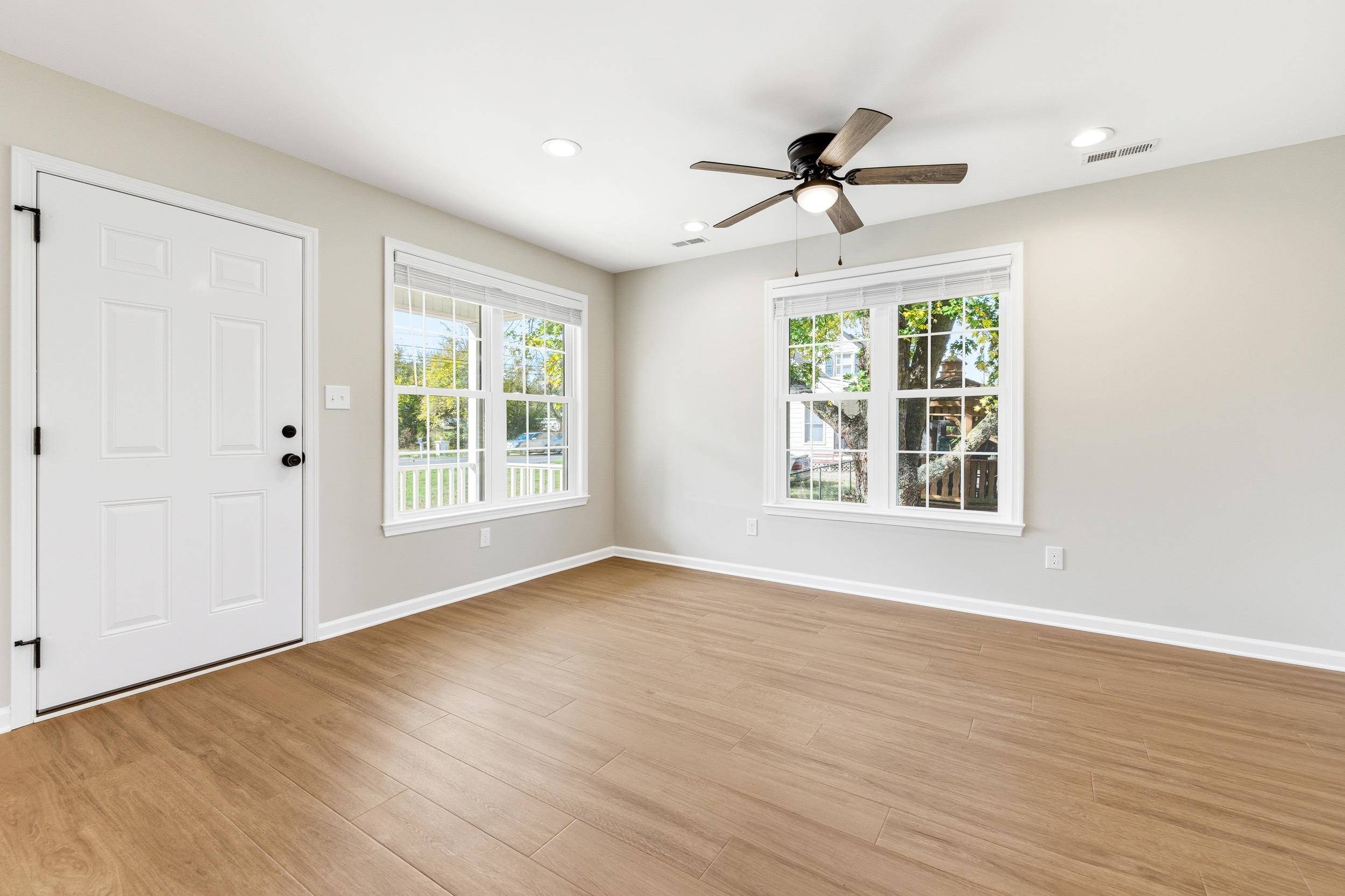 223 Fairview Road Luray, VA 22835 - Photo 11 of 63 a view of an empty room with wooden floor and a window