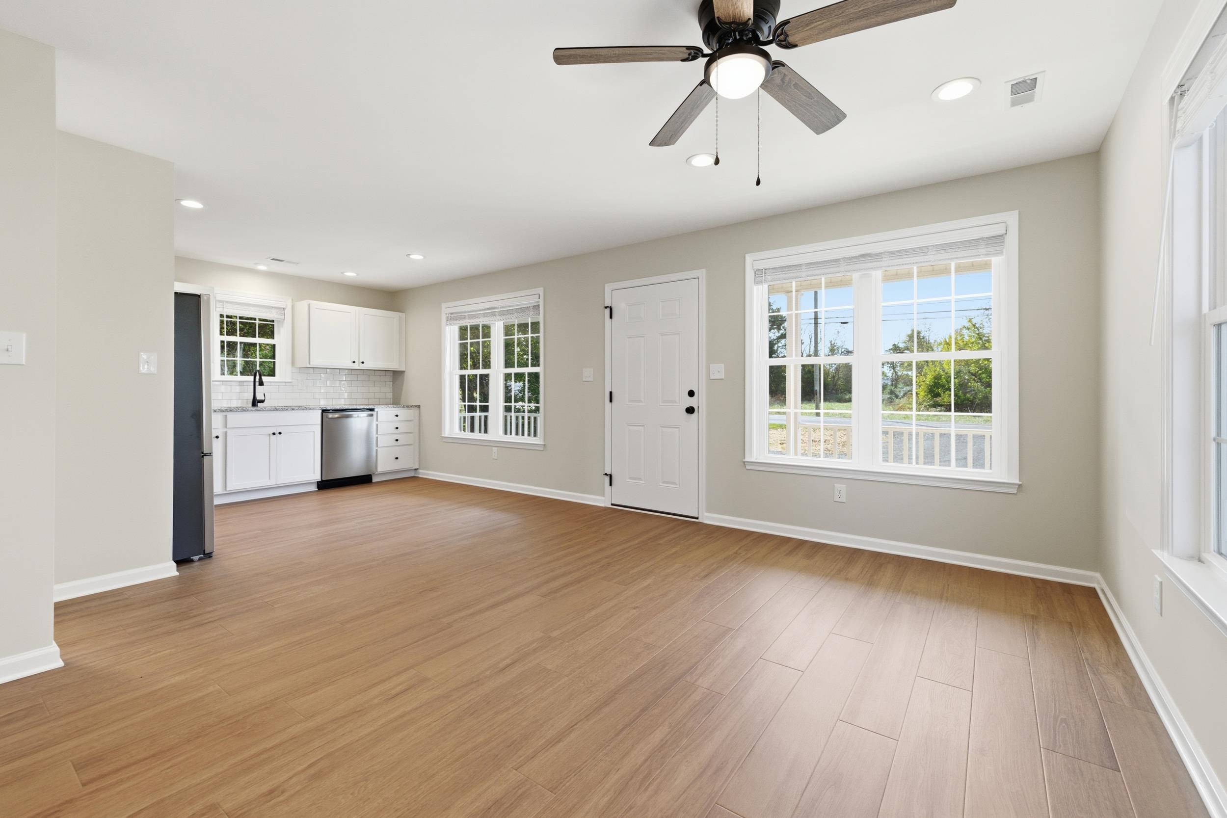 223 Fairview Road Luray, VA 22835 - Photo 13 of 63 a view of an empty room with a window and wooden floor