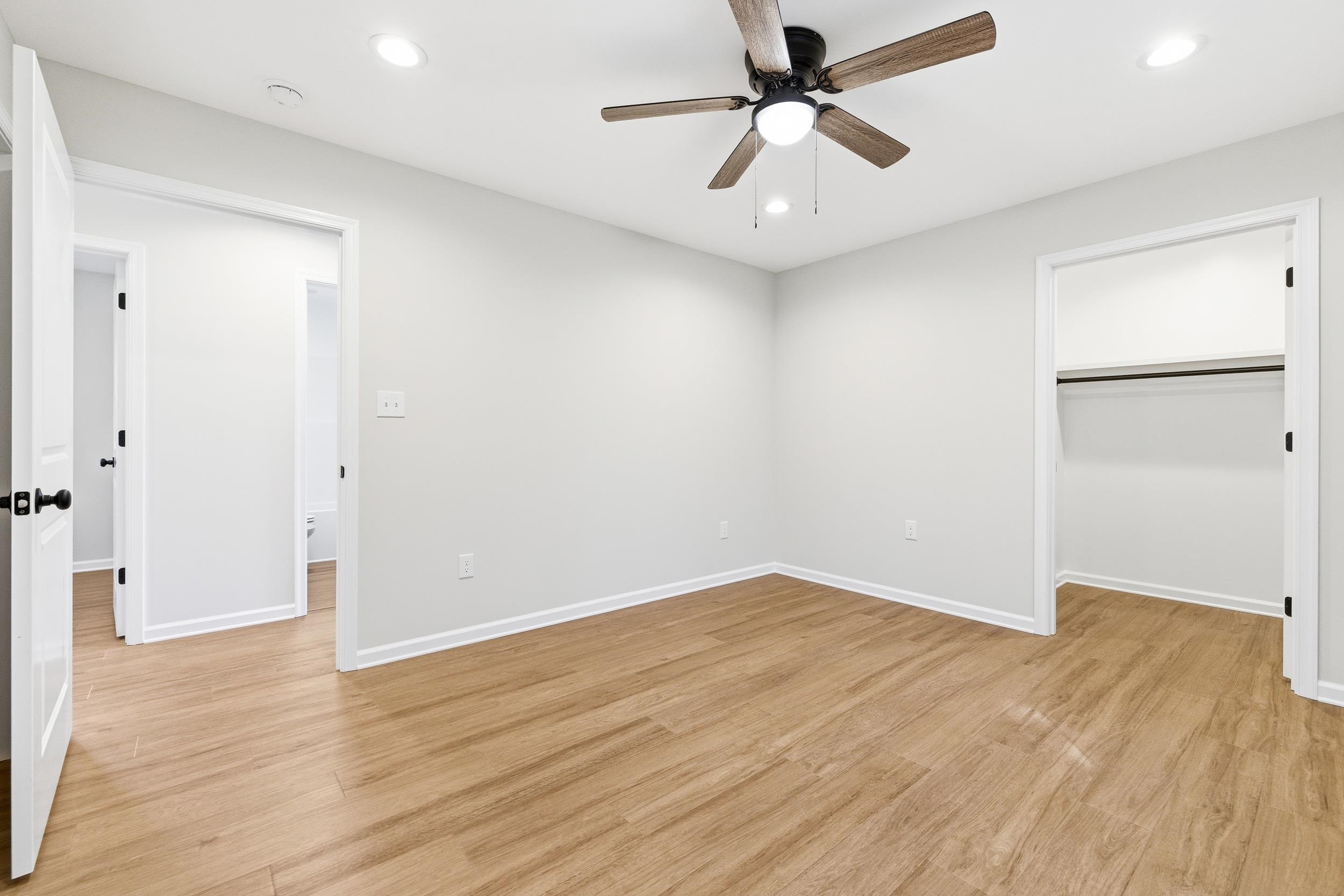 223 Fairview Road Luray, VA 22835 - Photo 18 of 63 an empty room with wooden floor and ceiling fan