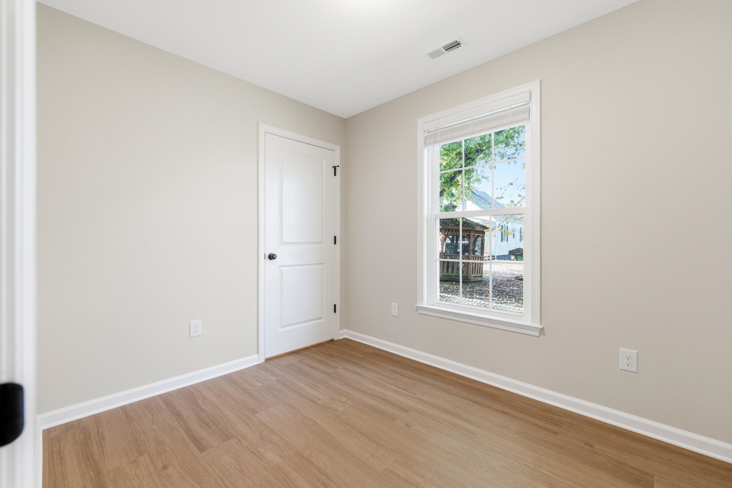 223 Fairview Road Luray, VA 22835 - Photo 23 of 63 an empty room with wooden floor and windows