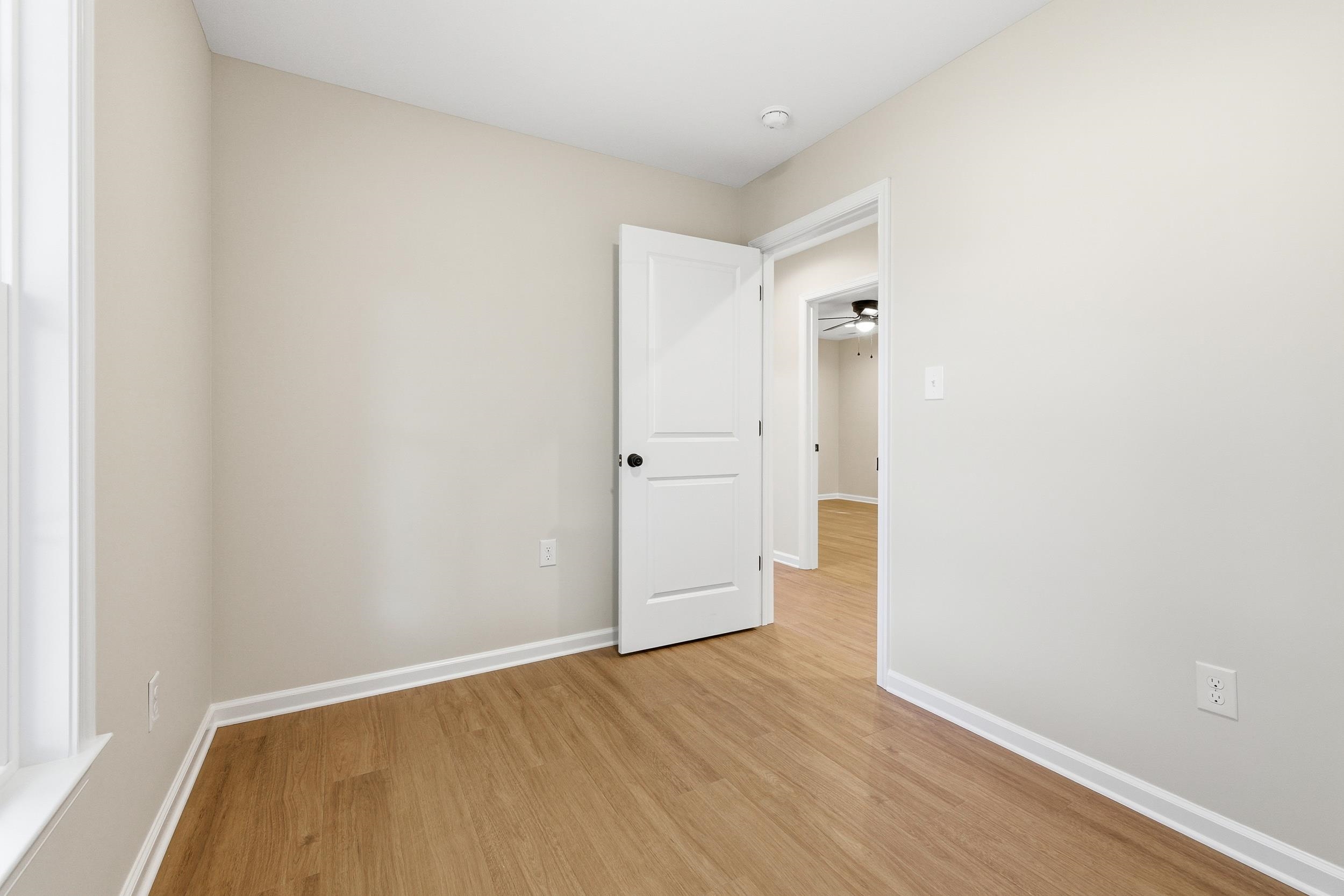 223 Fairview Road Luray, VA 22835 - Photo 26 of 63 a view of an empty room with wooden floor