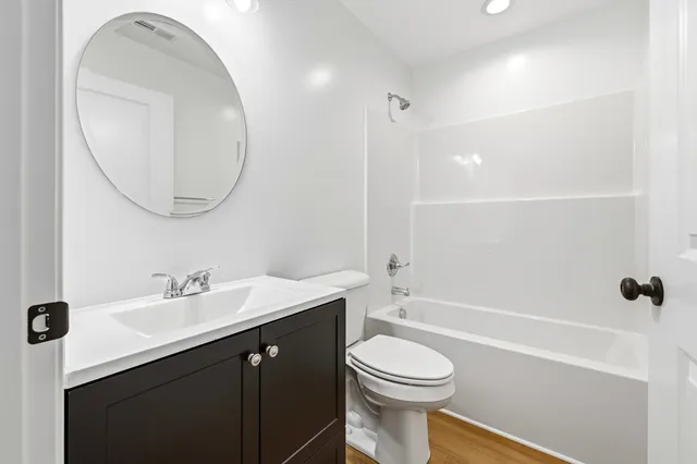 a bedroom with a bed and a view of bathroom