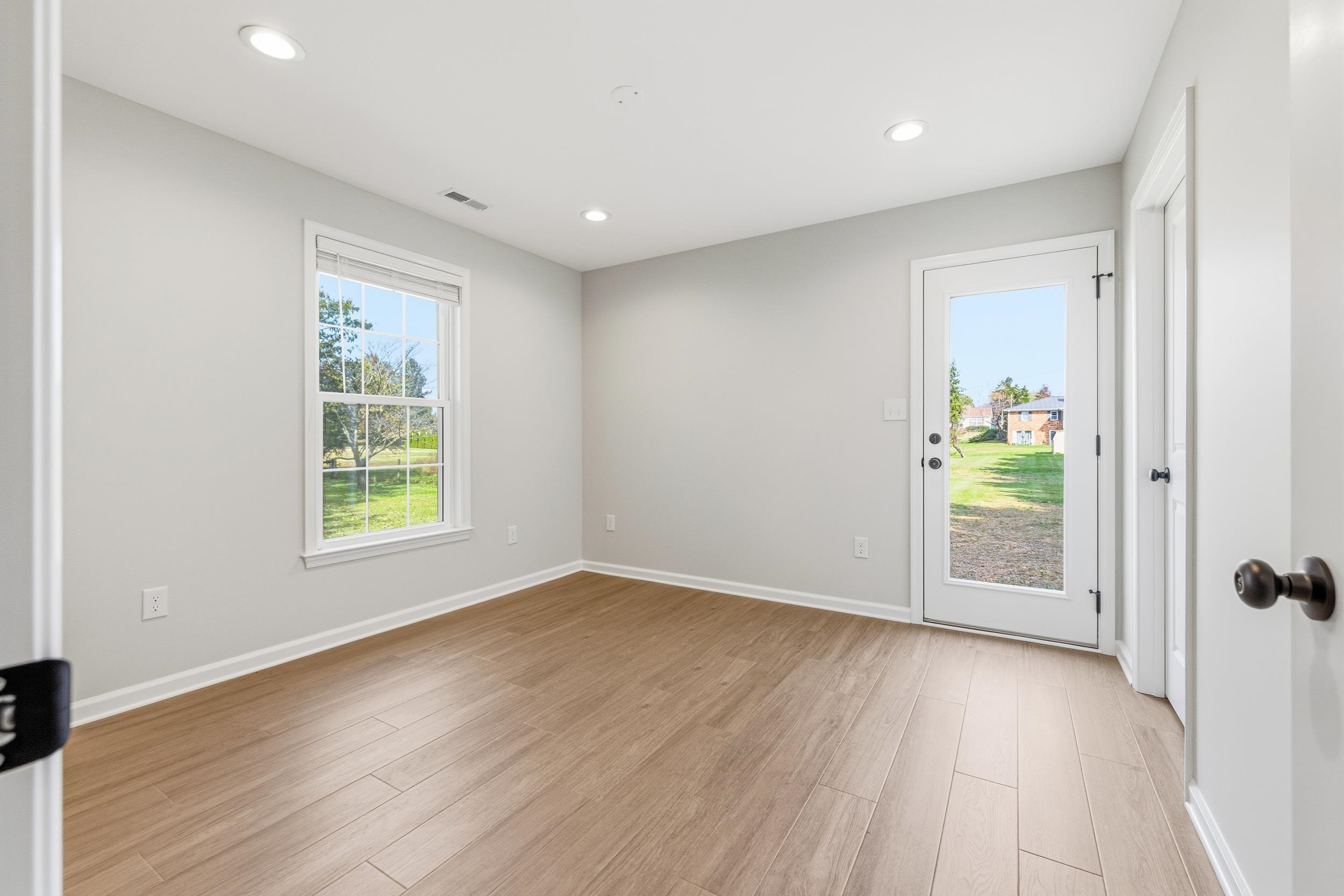 223 Fairview Road Luray, VA 22835 - Photo 28 of 63 a view of an empty room with wooden floor and a window