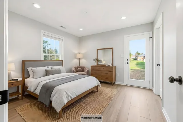 a view of a house with yard and a garden