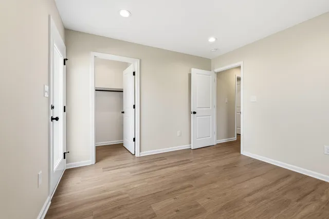 a view of a brick house with a large window