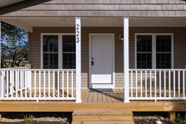 a view of balcony with wooden floor and outdoor space