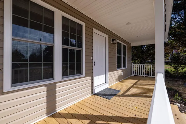 a backyard of a house with large trees
