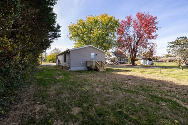 a view of a back yard of the house