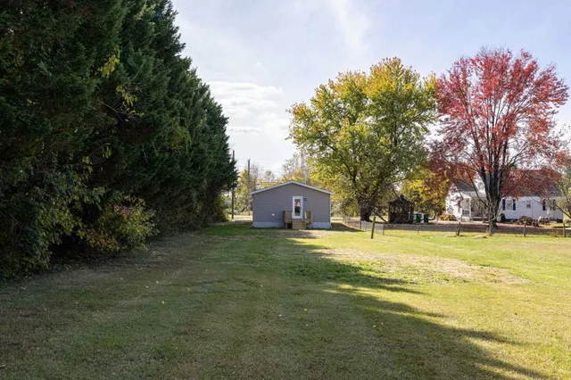 view of a house with a yard