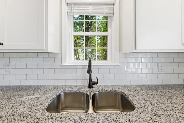 a kitchen with stainless steel appliances a refrigerator stove and microwave