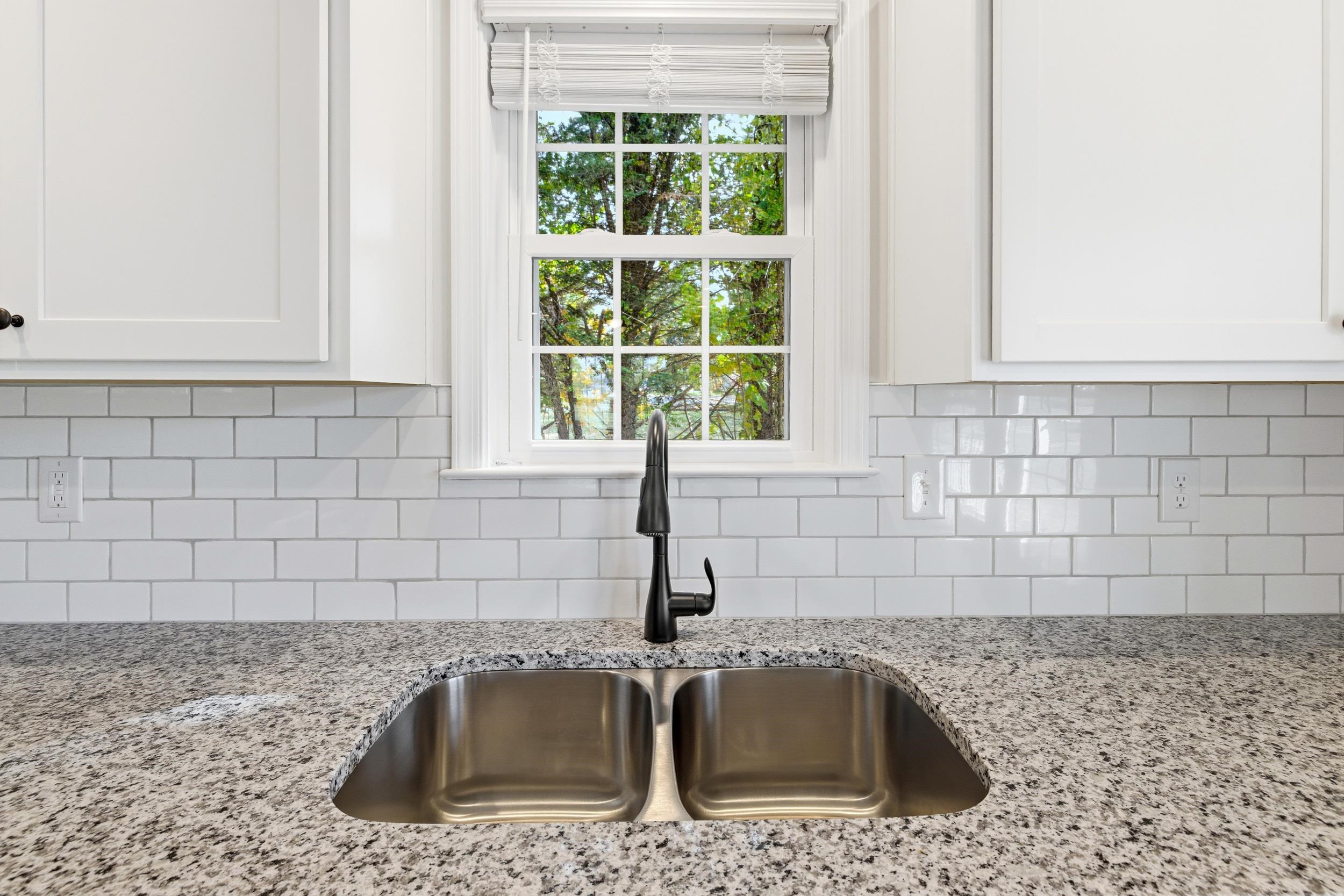 223 Fairview Road Luray, VA 22835 - Photo 7 of 63 a kitchen with granite countertop a sink a granite counter tops and a window