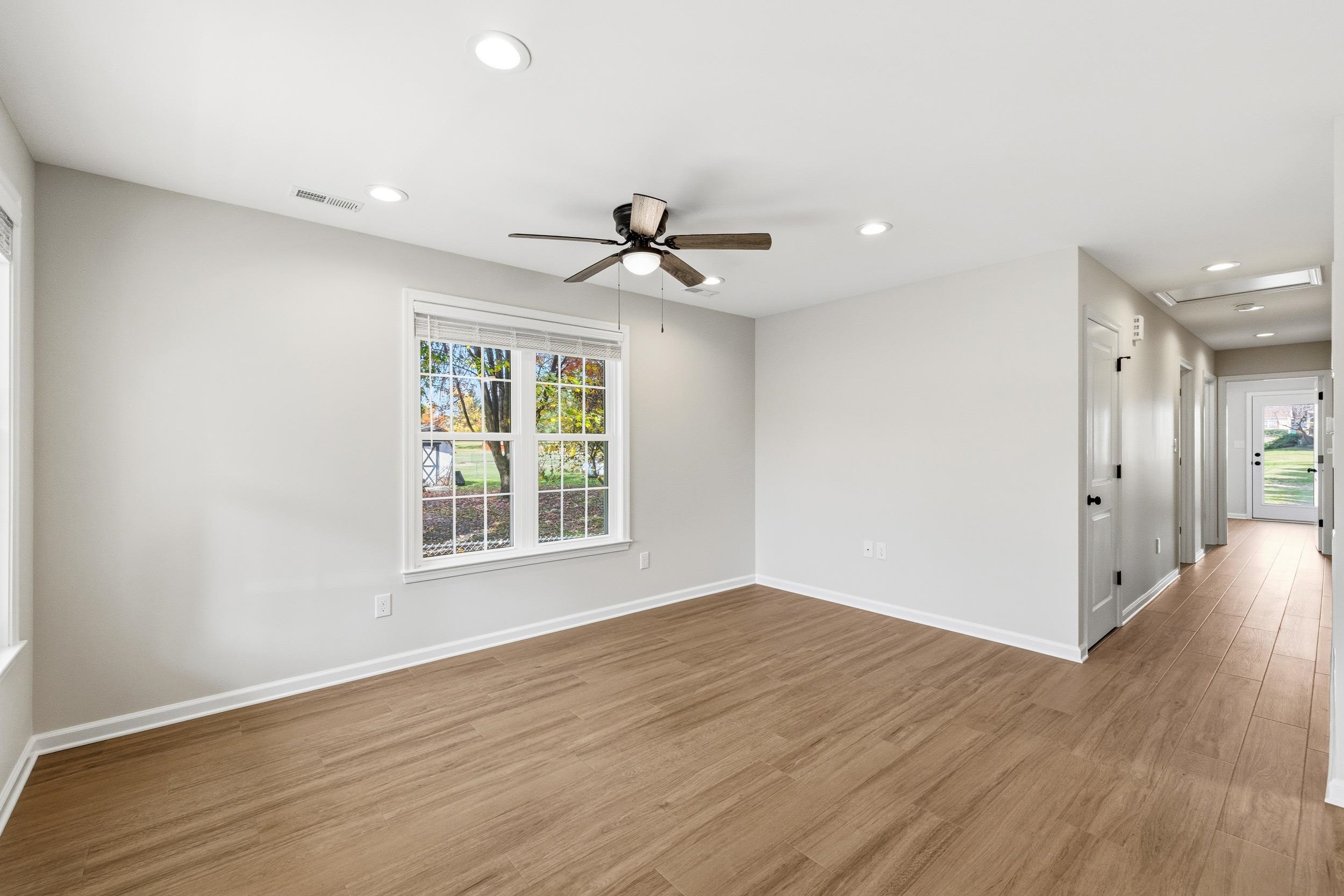 223 Fairview Road Luray, VA 22835 - Photo 9 of 63 wooden floor in an empty room with a window