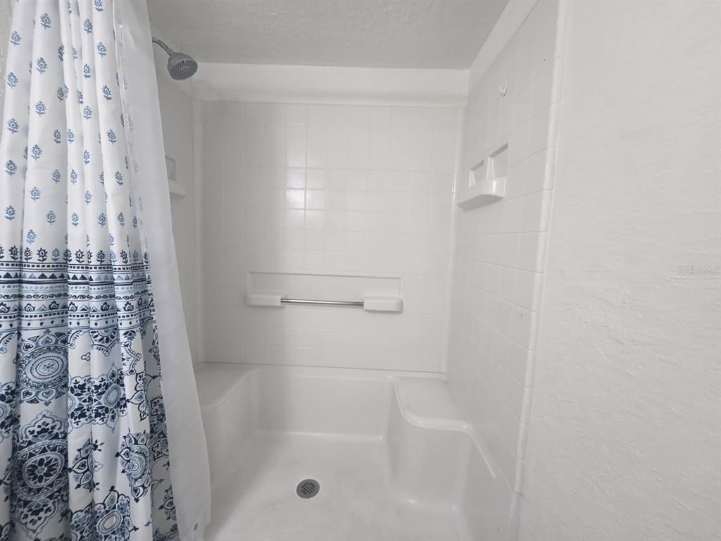 902 Lake Destiny Road, Unit C Altamonte Springs, FL 32714 - Photo 12 of 23 a bathroom with a shower