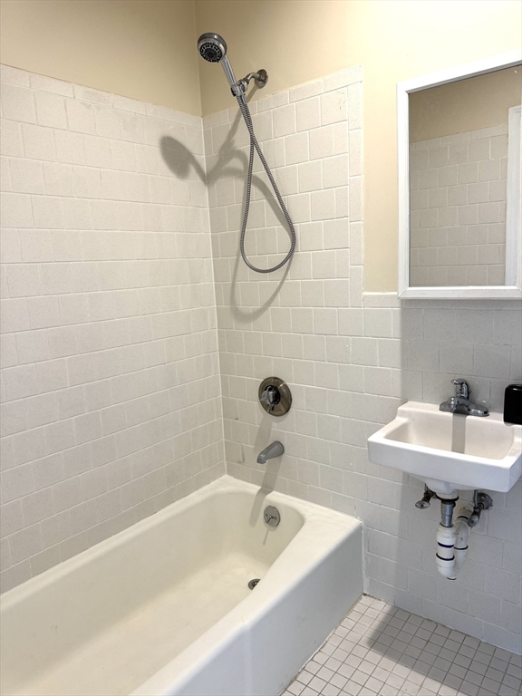 838 Western Avenue, Unit 2R Lynn, MA 01905 - Photo 6 of 9 a bathroom with a sink a mirror and a shower