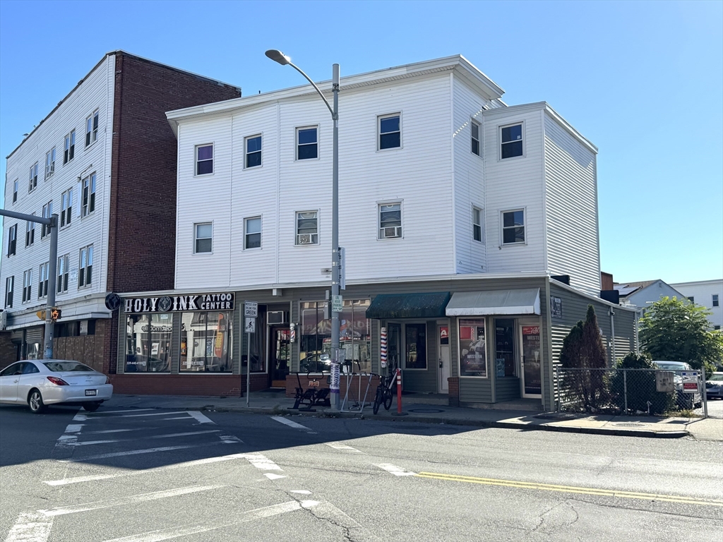838 Western Avenue, Unit 2R Lynn, MA 01905 - Photo 9 of 9 a view of street with large building and cars parked on road