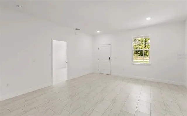 an empty room with windows