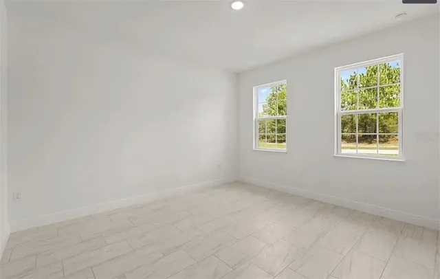 an empty room with windows