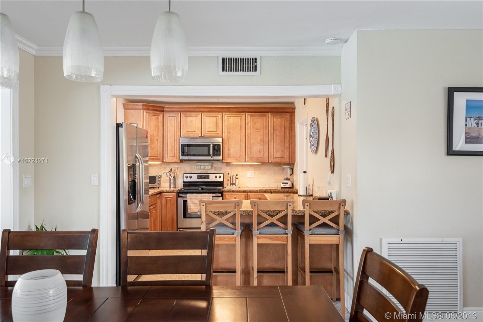 3514 West Park Road Hollywood, FL 33021 - Photo 22 of 23 KITCHEN FROM DINING
